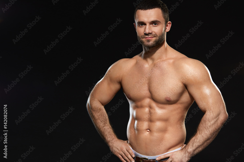 Man With Perfect Fit Abs And Muscular Body. Bodybuilding Man With Perfect Fit Abs And Muscular Body. Bodybuilding