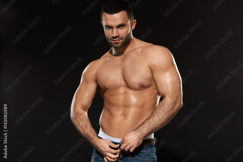 Fototapeta premium Man With Perfect Fit Abs And Muscular Body. Bodybuilding