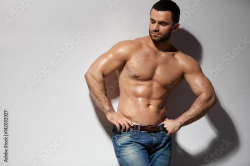 Handsome Smiling Young Man With Sexy Fit Muscular Body Indoors