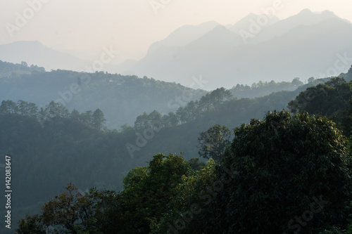 Mountain layer background in evening white cloud