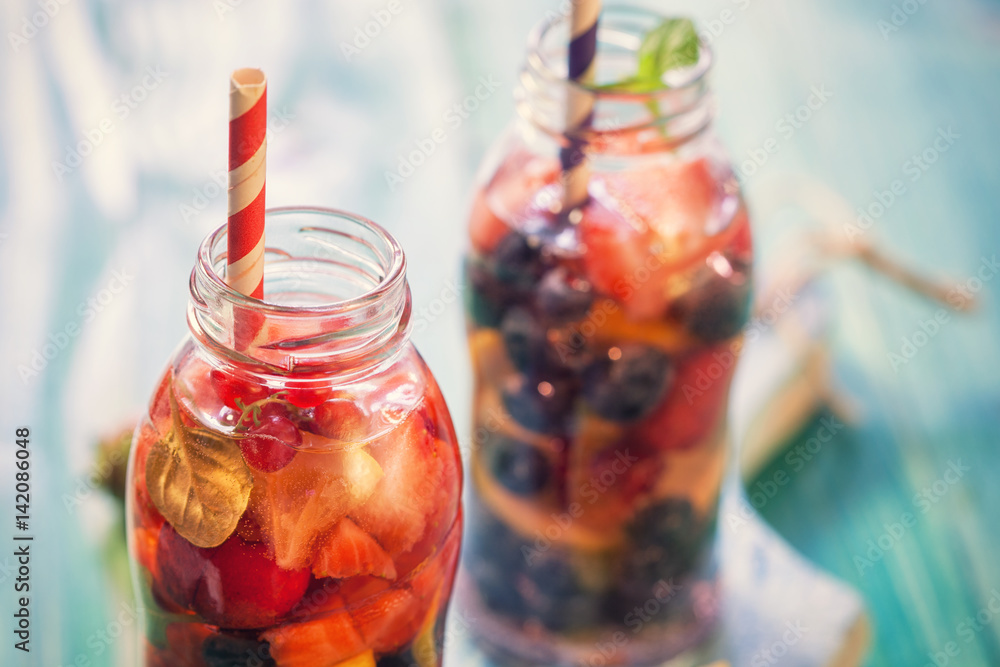 Infused water with fresh berry fruits,lemon, orange and Mint Infused water with fresh berry fruits,lemon, orange and Mint