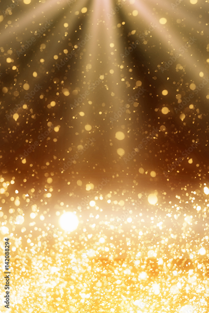 Golden sparkles and rays lights. Merry Christmas festive background.defocused circle bokeh or particles