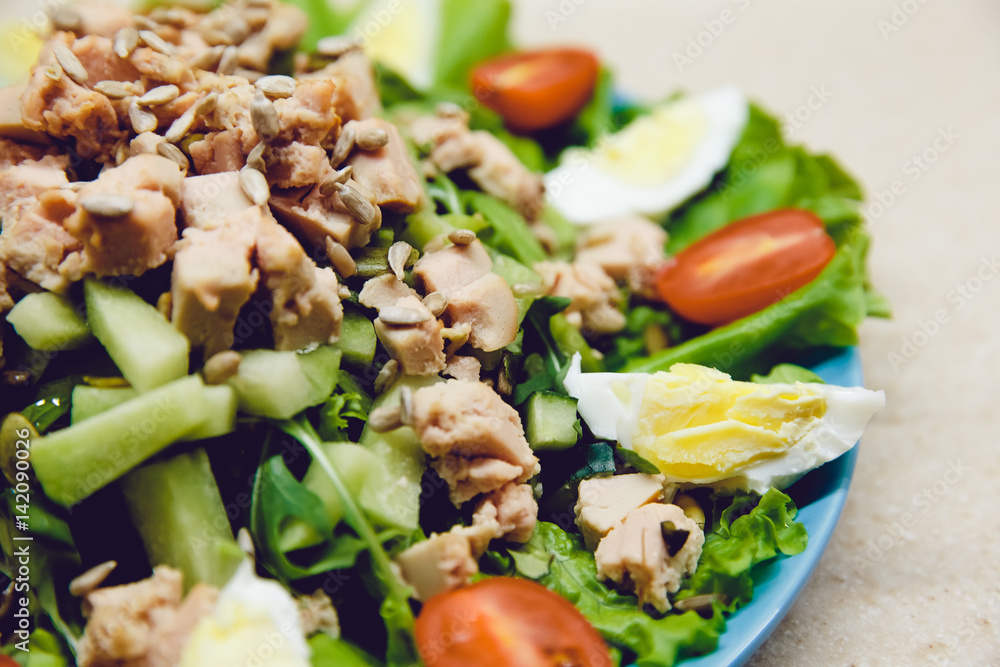 Salad with cucumber, boiled egg, tomato, cod liver, avocado, arugula. Fresh and healthy. Dietary food is prepared at home. Raw. Salad with cucumber, boiled egg, tomato, cod liver, avocado, arugula. Fresh and healthy. Dietary food is prepared at home. Raw.