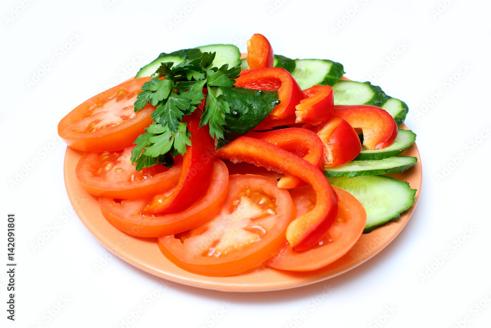 tomato, bell pepper and cucumber slices on plate on white background tomato, bell pepper and cucumber slices on plate on white background