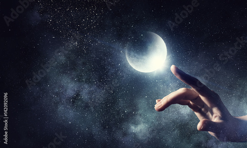 Moon planet in hand