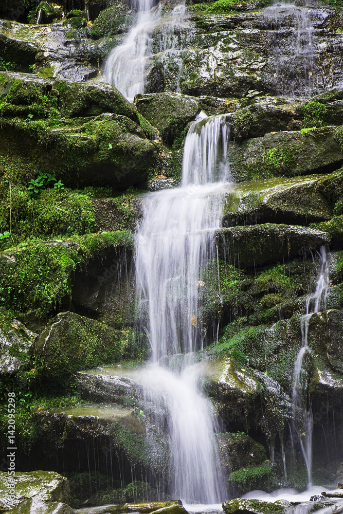 Waterfall in the mountains. Early spring in the Carpathians Ukraine. Travel. Waterfall in the mountains. Early spring in the Carpathians Ukraine. Travel.