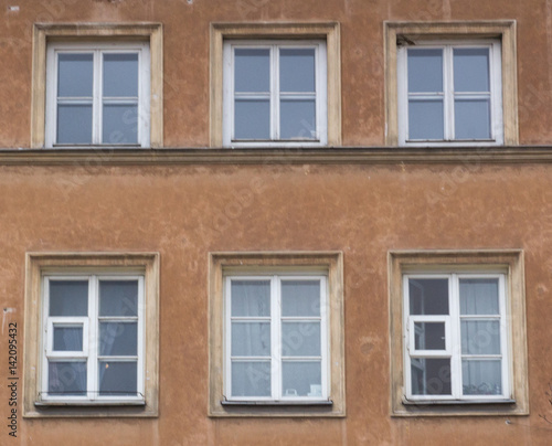 Eight modern windows on the facade of the house