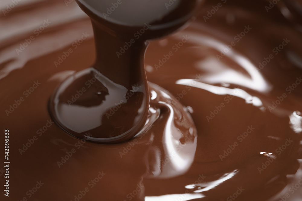 macro photo of premium dark chocolate pour in bowl macro photo of premium dark chocolate pour in bowl