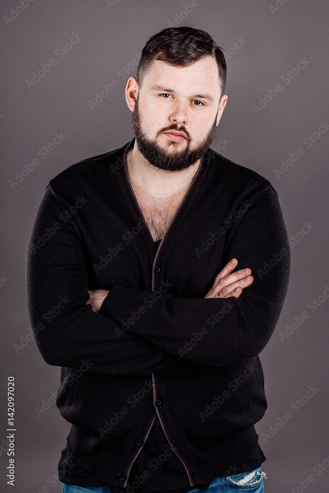 Obraz premium young business man with suspicious emotion. human emotion expression and lifestyle concept. image on a white studio background.