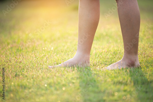 barefoot on the green grass