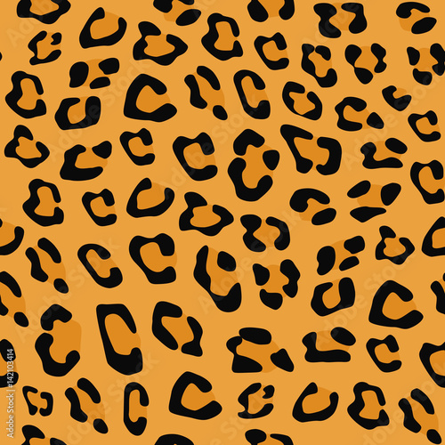 Seamless pattern. Imitation print of skin of leopard. Black and brown spots on brown background.