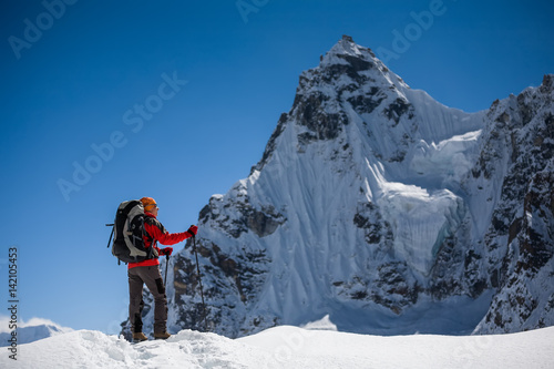 Trekker is walking by Renjo La pass in Everest region © Maygutyak