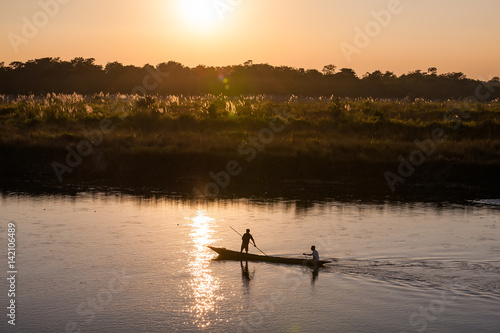 November 17, 2013 - men are fishing on Rapti river at the border of Chitwan national park, Nepal