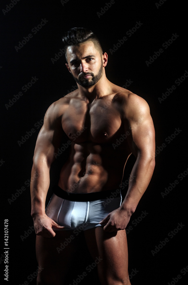 handsome muscular macho man with sexy athlete body in pants