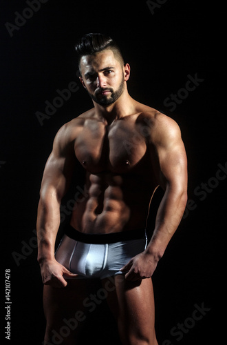 handsome muscular macho man with sexy athlete body in pants © Volodymyr