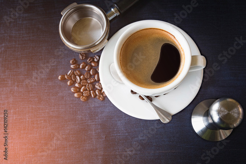 Coffee cup and beans with Equipment for coffee photo