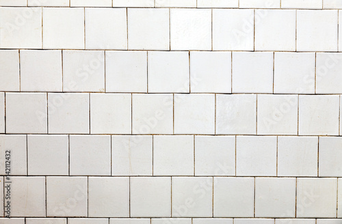A bright wall of white tile.