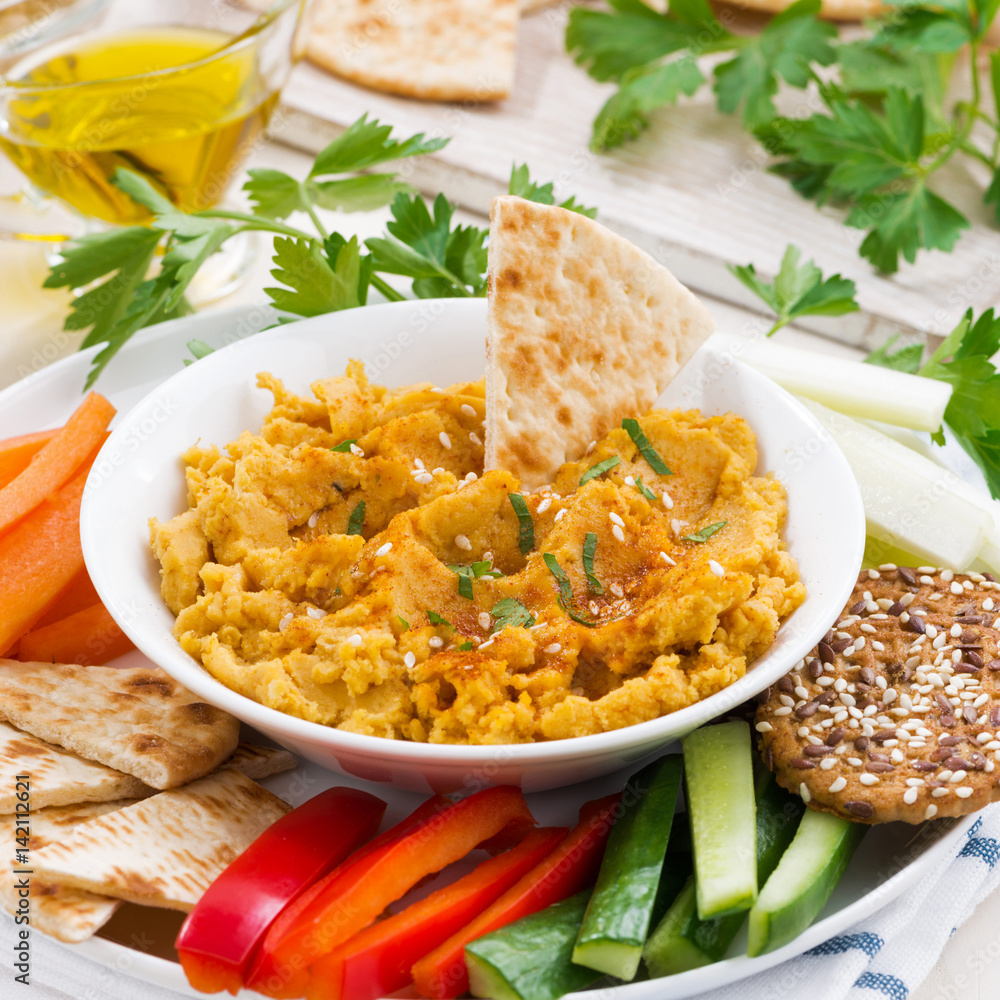 Arabic sauce hummus with fresh vegetables and pita bread Arabic sauce hummus with fresh vegetables and pita bread
