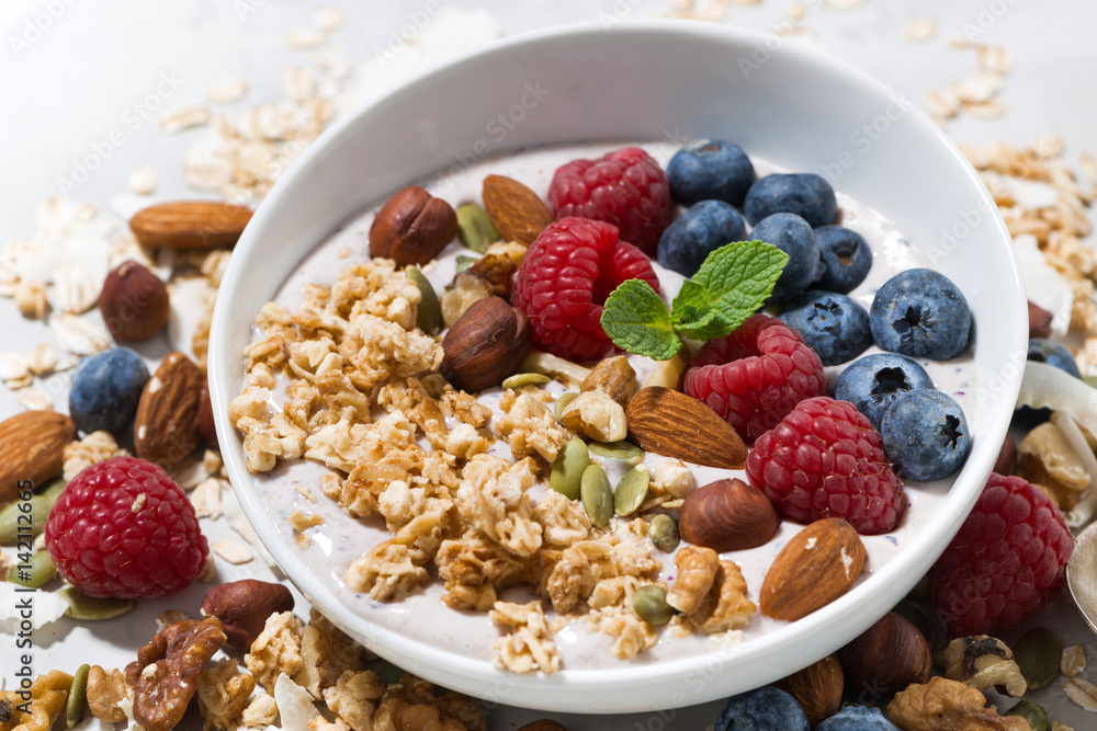 homemade muesli with yogurt and berries, closeup homemade muesli with yogurt and berries, closeup