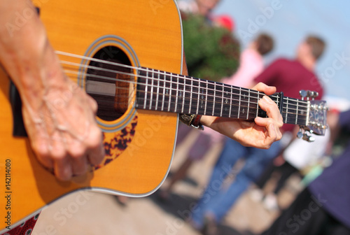 Playing guitar outside