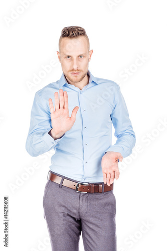 businessman making stop sign with hand. emotions and people concept. © kaninstudio