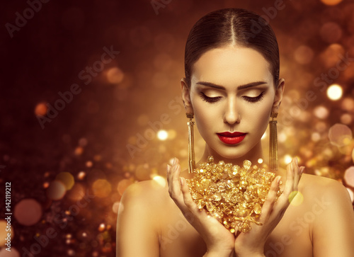 Fashion Model Holding Gold ...