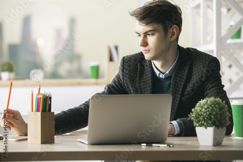 Handsome gentleman working on project