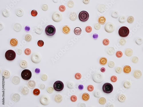 Background of multi-colored buttons. Abstract background. Pattern of buttons on a white background.