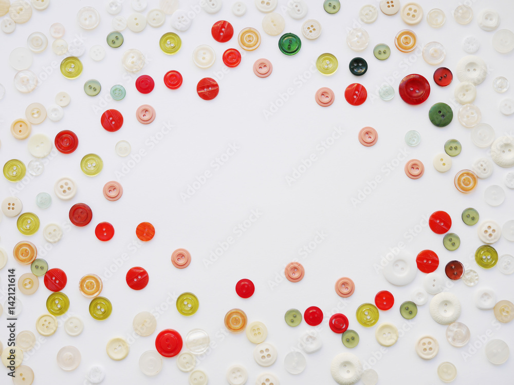 Frame of buttons on a white background. Background of multi-colored buttons. Abstract background. Pattern of buttons on a white background. Frame of buttons on a white background. Background of multi-colored buttons. Abstract background. Pattern of buttons on a white background.