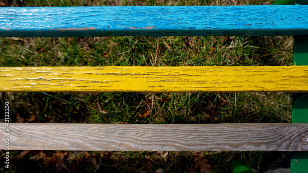 old wooden slats painted in blue and yellow. old wooden slats painted in blue and yellow.