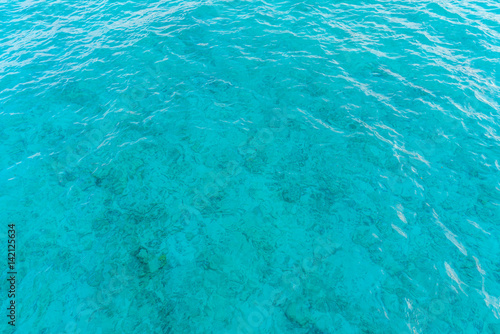 Top view of the sea with the coral reefs at Maldives island .