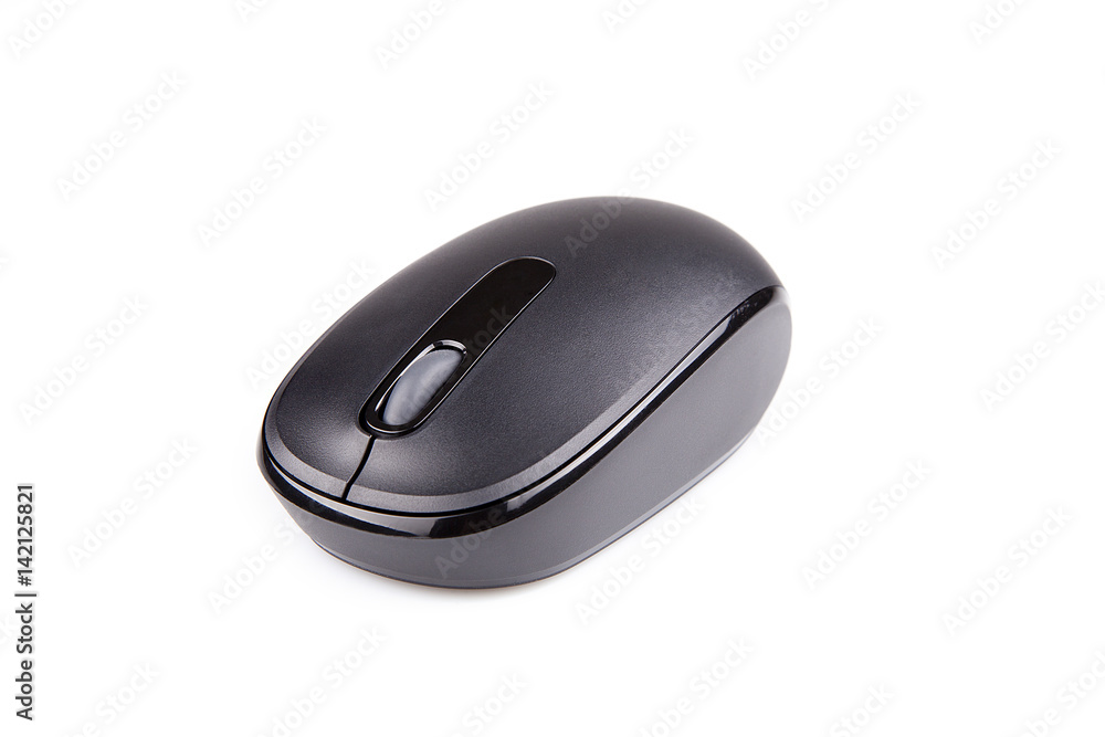 Black wireless mouse on a white surface. Isolated on white background. Black wireless mouse on a white surface. Isolated on white background.