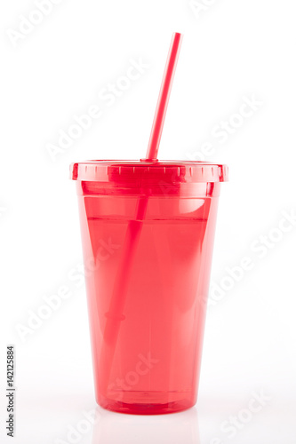 Wallpaper Mural Red plastic travel cup with straw on a white surface. Isolated on white background. Torontodigital.ca