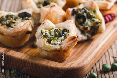 Fényképezés Homemade spinach and feta cheese puff pastry cups