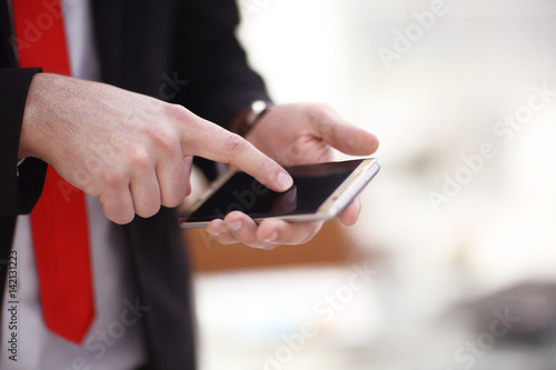 close up hands multitasking man using phone connecting wifi photo