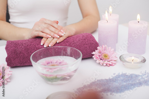 french manicure with rose flowers. spa