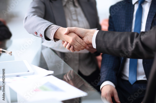 Close up view of business partnership handshake concept.Photo of two businessman handshaking process.Successful deal after great meeting © Danuta