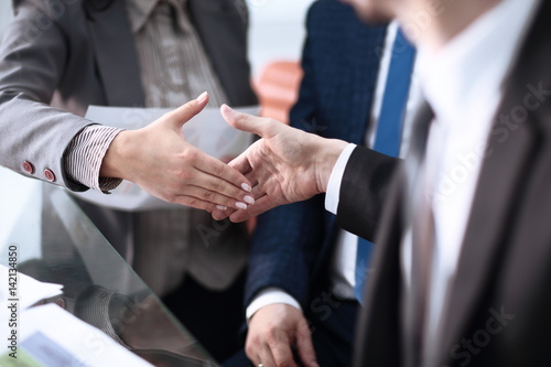 Close up view of business partnership handshake concept.Photo of two businessman handshaking process.Successful deal after great meeting