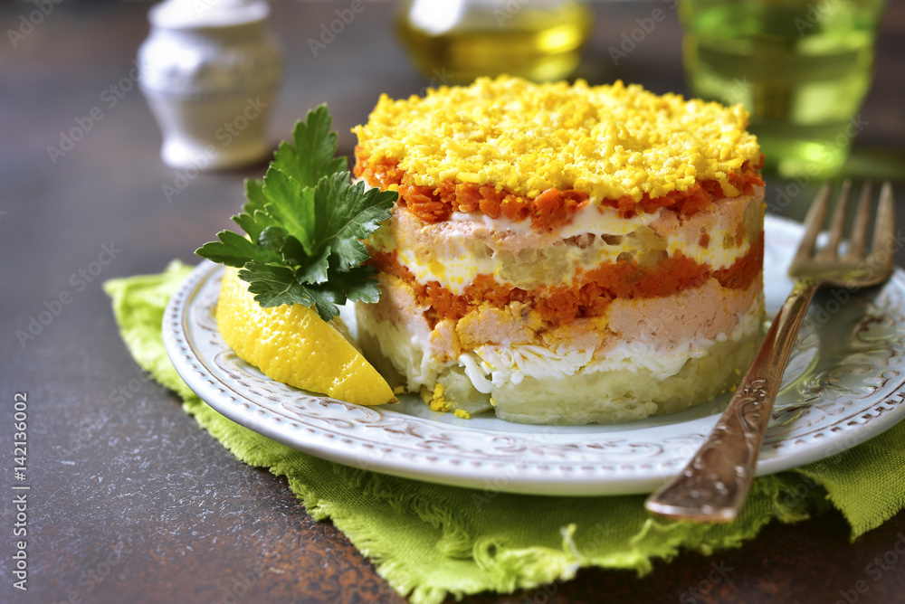 Layered salad with vegetables and salmon Layered salad with vegetables and salmon