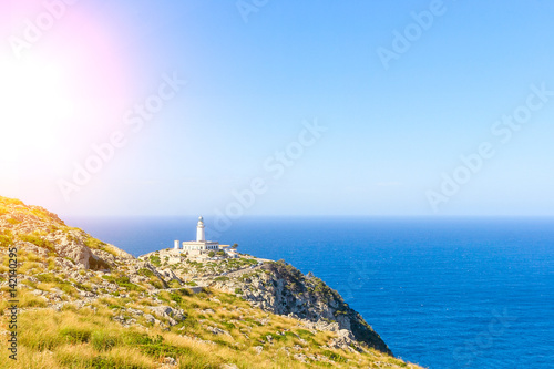 Lighthouse at Cape Formentor near rocks for print