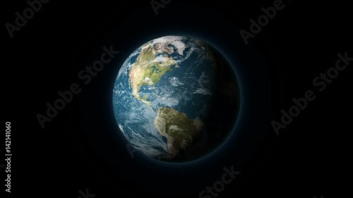 Realistic Earth rotating on a black background. Seamlessly loopable animation.