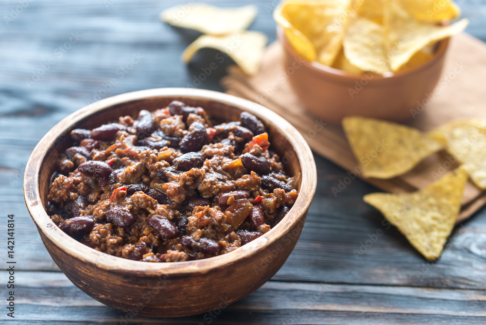 Bowl of chili con carne with tortilla chips Bowl of chili con carne with tortilla chips