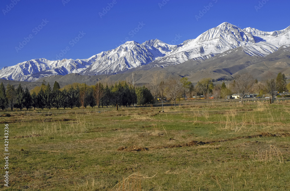 Alpine scene with snow capped mountains in the Eastern Sierra near Yosemite National park, Sierra Nevada Mountains, California a popular place for RV trips, family vacations, backpacking and hiking