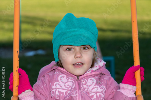 Little girl on swing at playground  © nedomacki