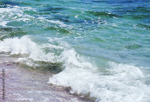 sea wave splashing on the beach shore © Red Frog Photo