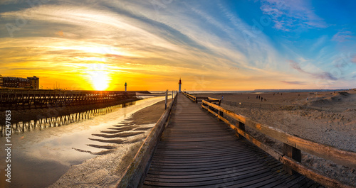 Wooden Pier and Lighthouse