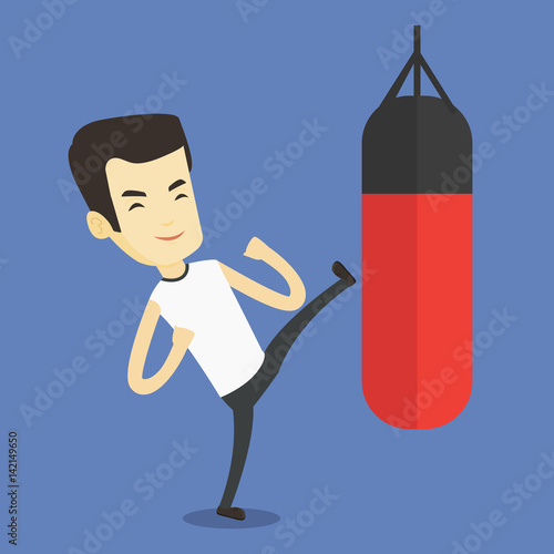 Man exercising with punching bag.