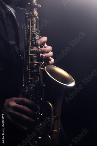 Saxophone player Saxophonist playing sax alto. Musical instruments