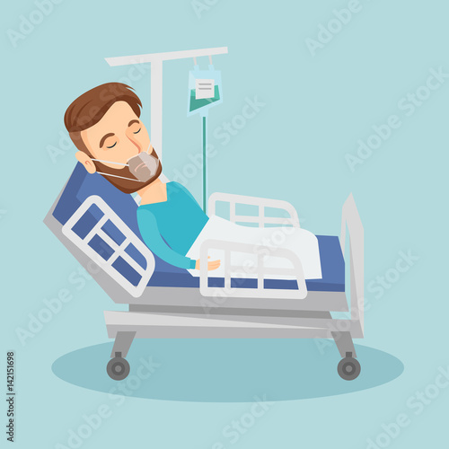 Patient lying in hospital bed with oxygen mask.