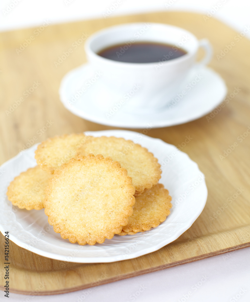 Mini coconut biscuit and a cup of coffee Mini coconut biscuit and a cup of coffee